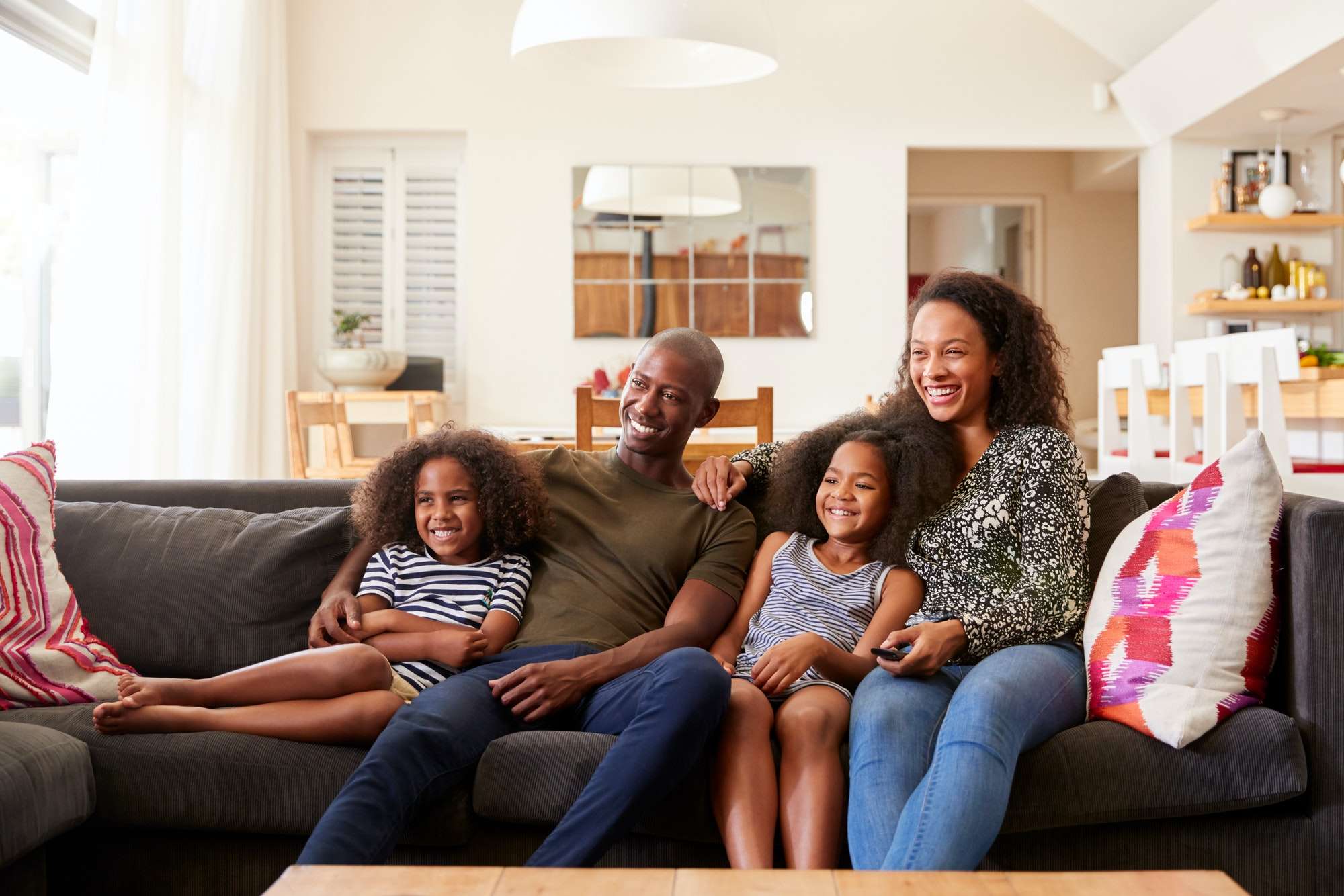 Family watching 4K Ultra HD IPTV on Smart TV